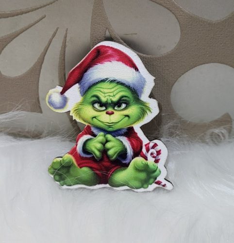 Formára vágott ülő Grinch baby